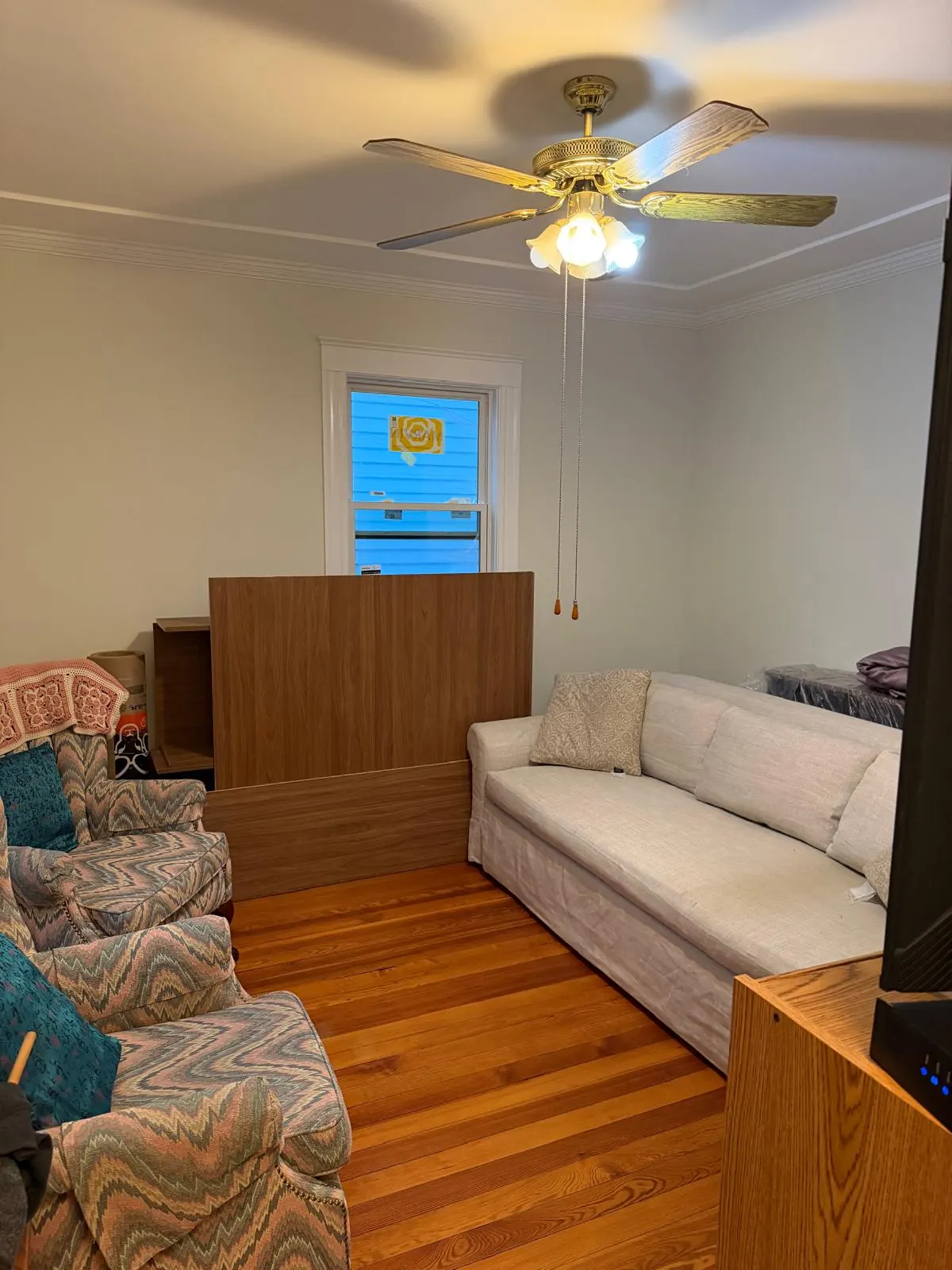 Living room before and after interior painting by MF Remodeling Services