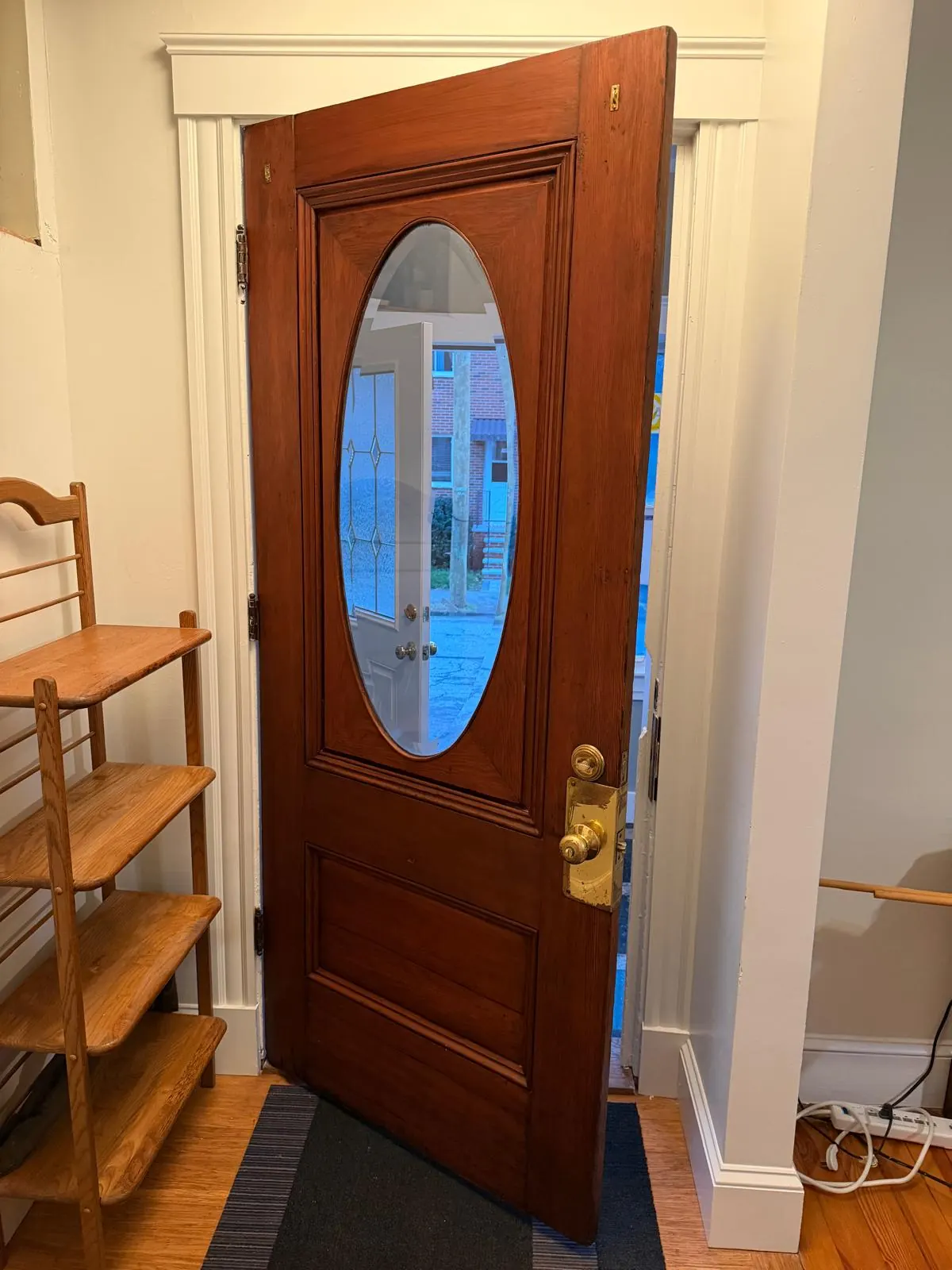 Wood front door before and after refinishing by MF Remodeling Services