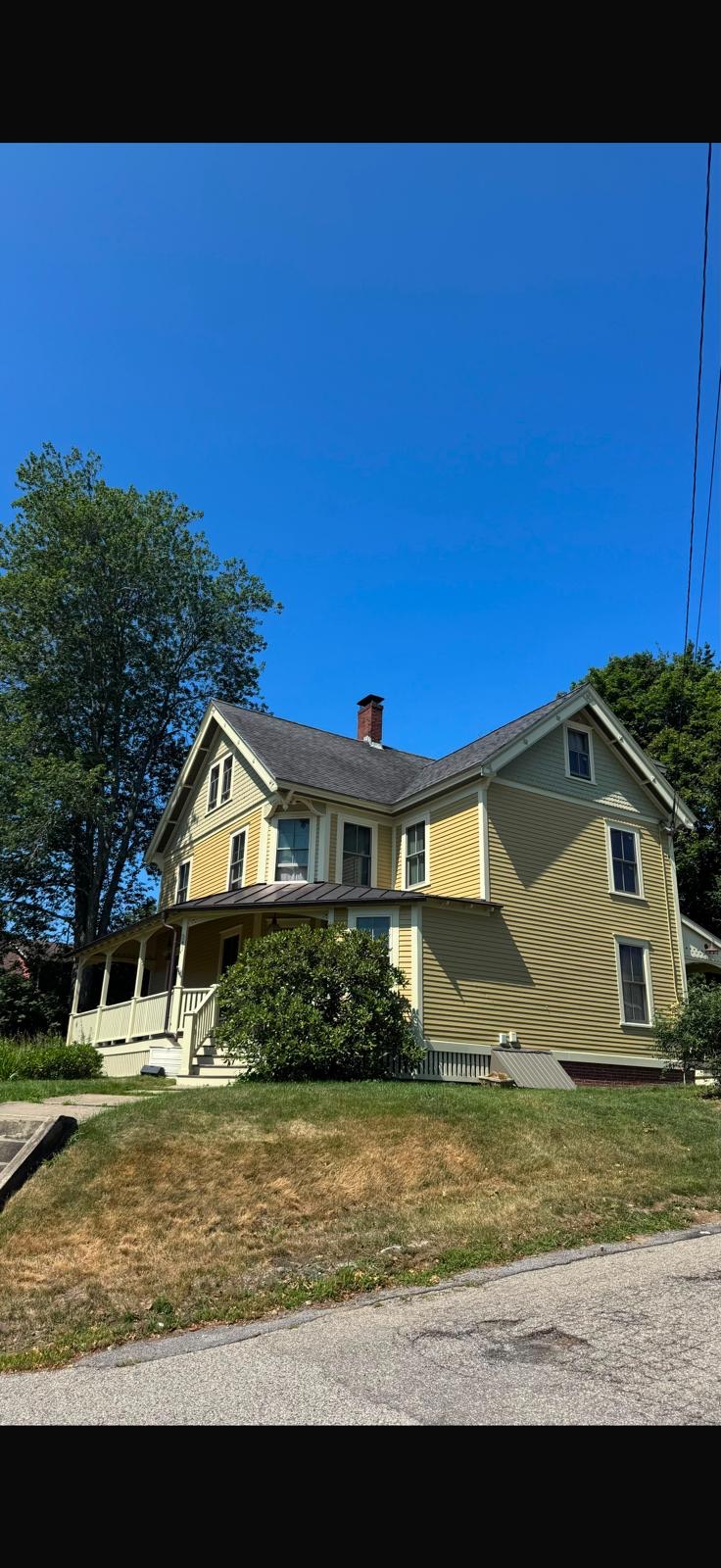 Yellow Victorian exterior repaint near Peabody